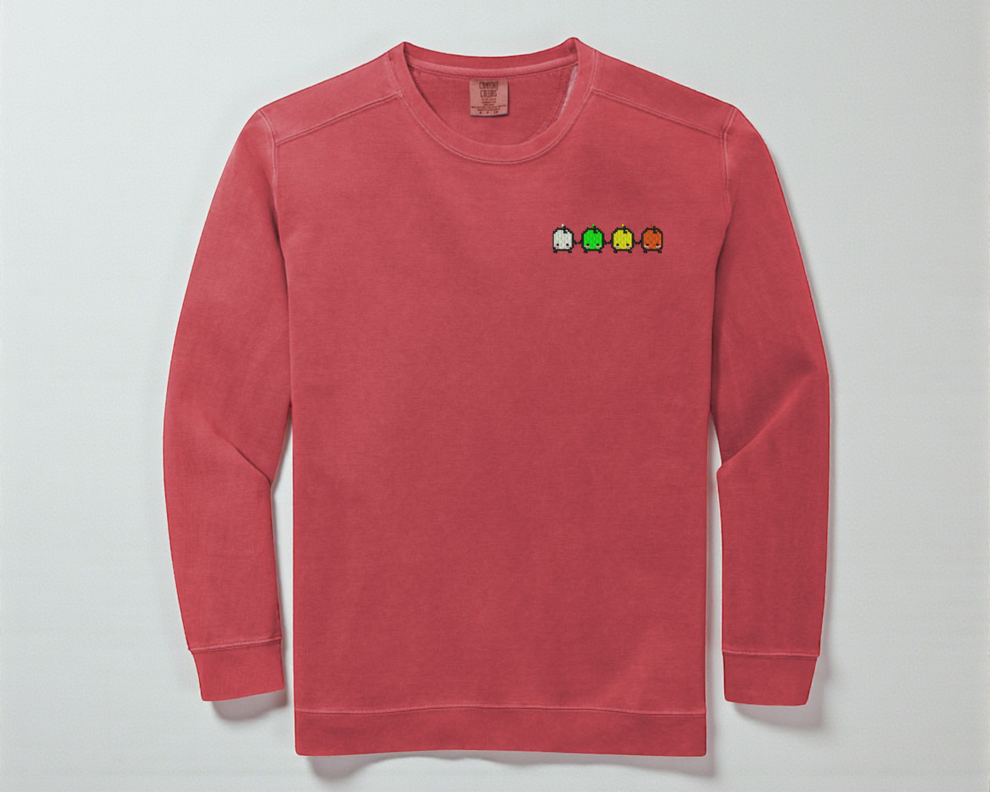 An Embroidered Crewneck of the Forest Spirits from Stardew Valley in Watermelon from Comfort Colors.