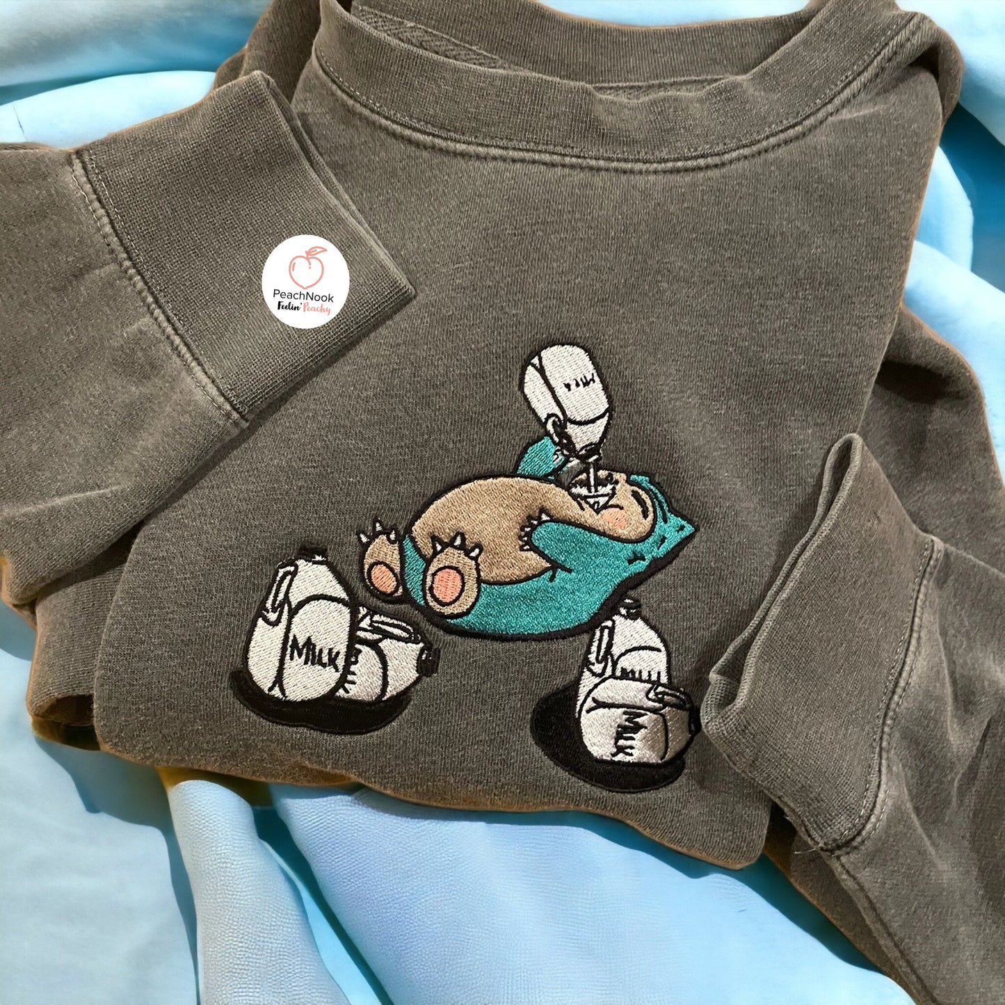 Embroidered Snorlax n' Milk Sweatshirt – Playful & Cozy Apparel