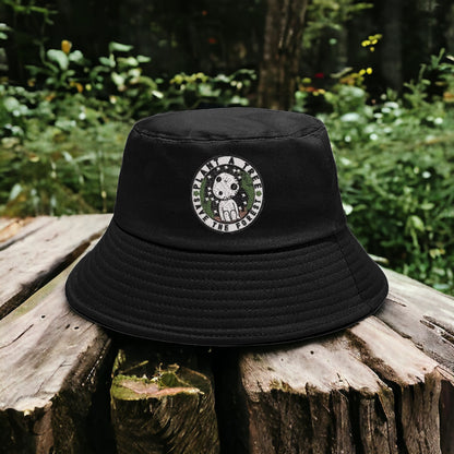 A black bucket hat with a white embroidered design featuring Kuroma