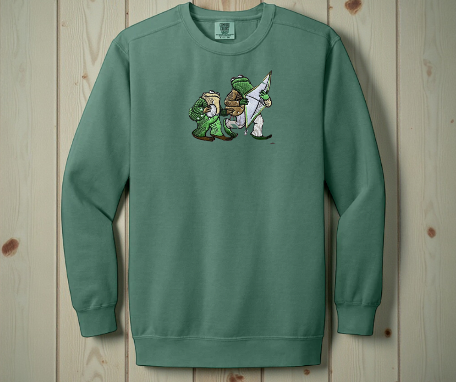 Light Green White Comfort Colors 1566 sweatshirt featuring detailed embroidery of Frog and Toad with a kite. Vintage bookish aesthetic crewneck.