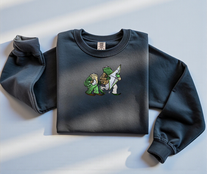 Pepper White Comfort Colors 1566 sweatshirt featuring detailed embroidery of Frog and Toad with a kite. Vintage bookish aesthetic crewneck.