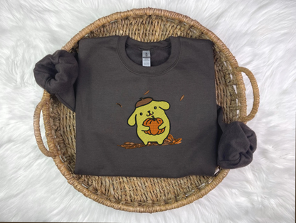 A black sweatshirt with a cartoon animal character embroidered on the front named PomPom