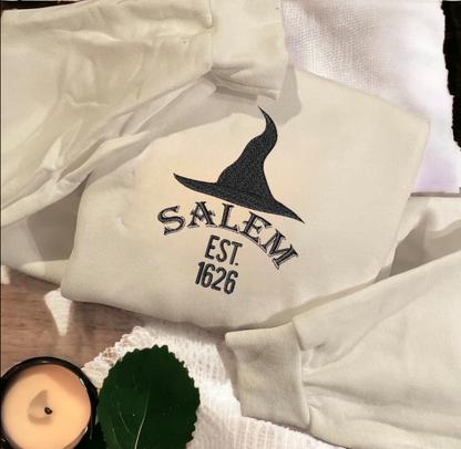 Salem Witch Embroidered Sweatshirt – Cozy Halloween sweatshirt with detailed witch embroidery, perfect for spooky autumn fashion.
