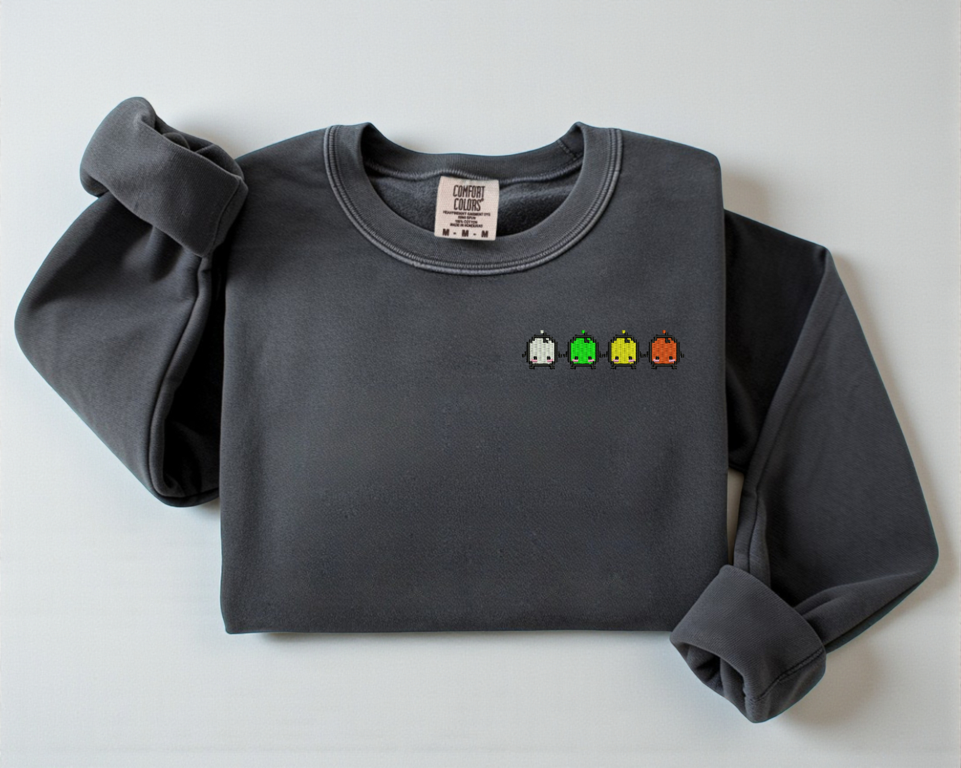 A gray sweatshirt from Comfort Colors with an embroidered design of the Forest Spirits from Stardew Valley.