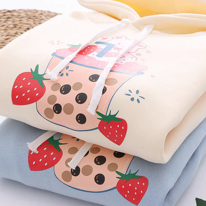 sweatshirts with strawberry and bubble tea design on a light background