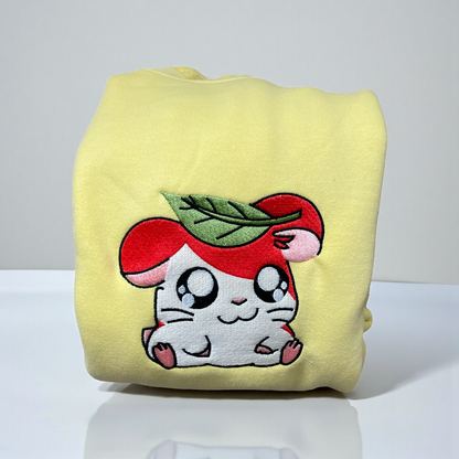 Embroidered Hamtaro sweatshirt with a leaf on his head on a Butter Comfort Colors crewneck.