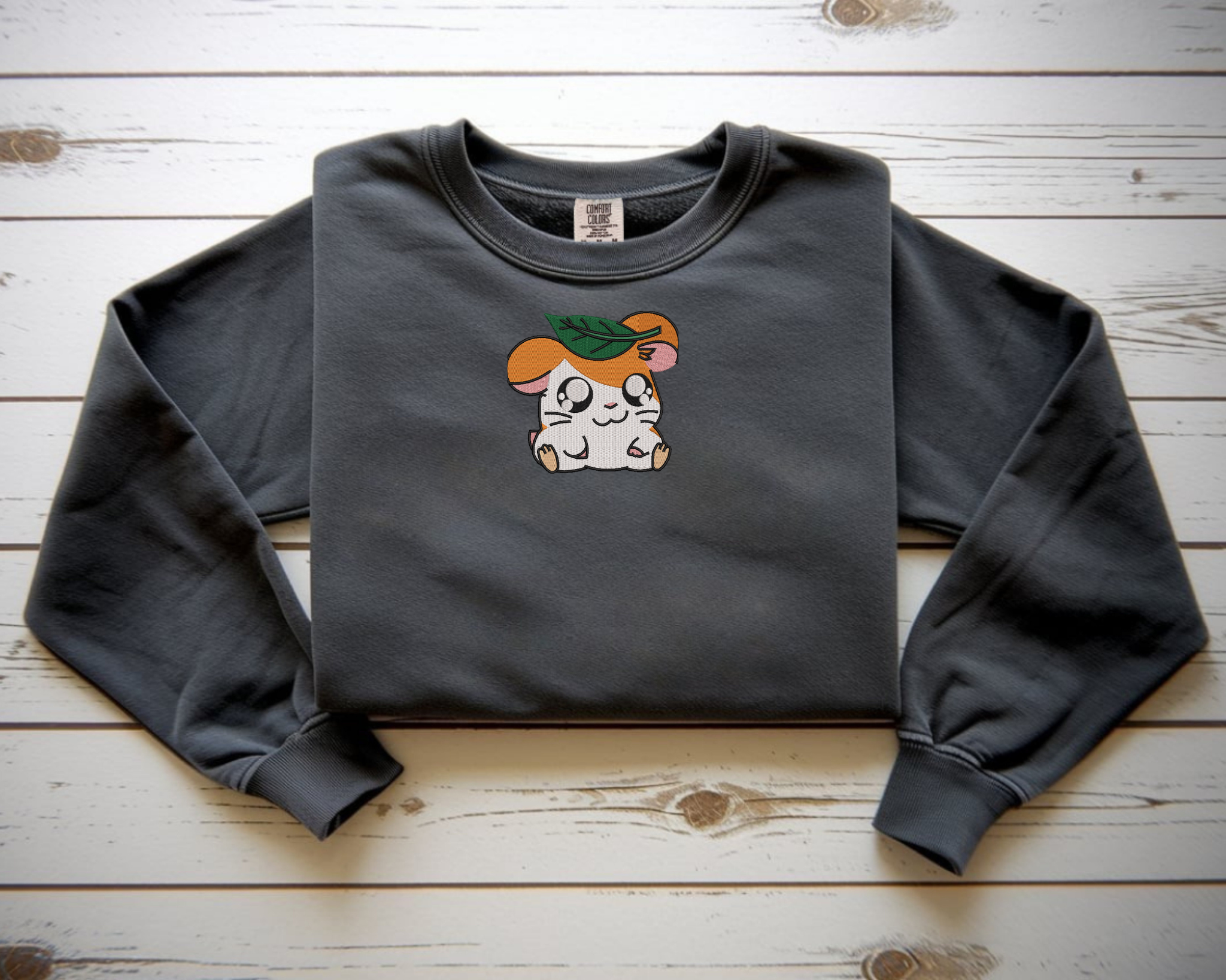  Embroidered Hamtaro sweatshirt with a leaf on his head on a pepper Comfort Colors crewneck