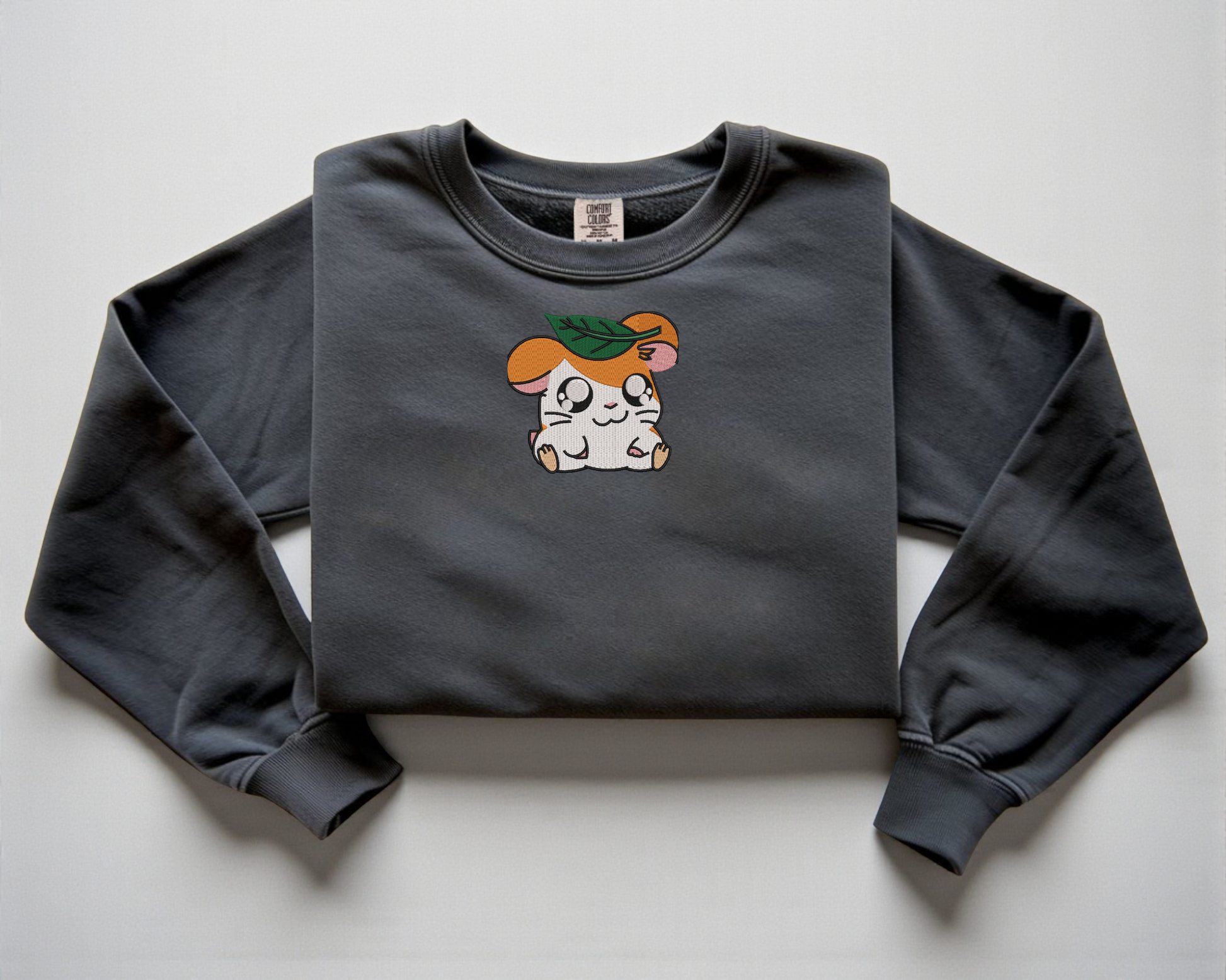  Embroidered Hamtaro sweatshirt with a leaf on his head on a pepper Comfort Colors crewneck
