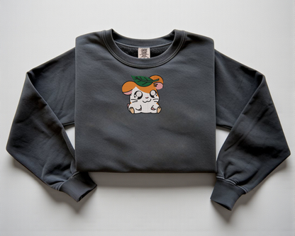  Embroidered Hamtaro sweatshirt with a leaf on his head on a pepper Comfort Colors crewneck