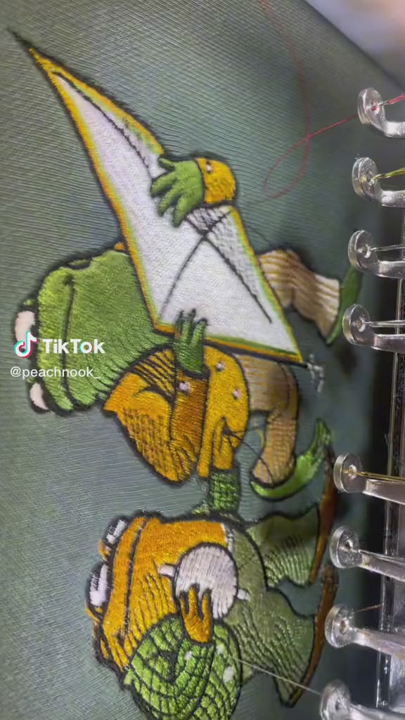 Frog and Toad getting Embroidered on light green Comfort Colors 1566 sweater