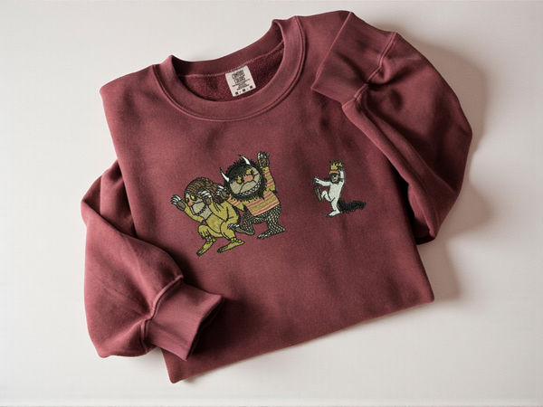 Where the Wild Things Are embroidered on a crimson Comfort Colors crewneck sweatshirt.